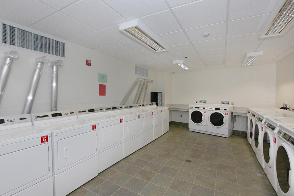 a laundry room with washes and dryers in it