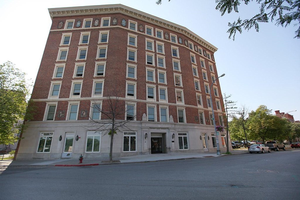 a large brick building on the corner of a street