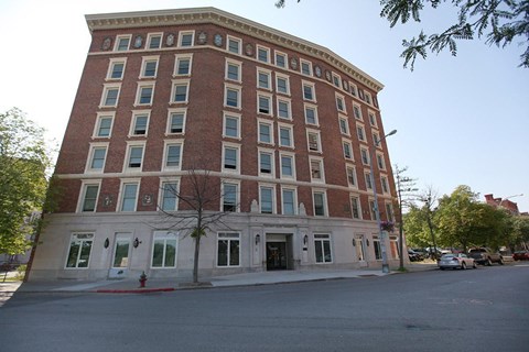 a large brick building on the corner of a street
