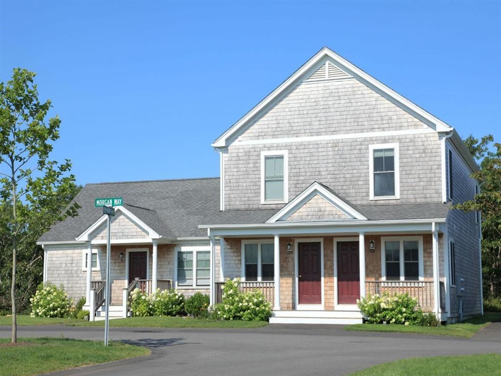 a house with a street sign in front of it