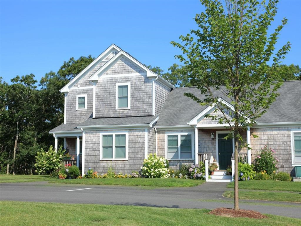 a house with a tree in the front yard