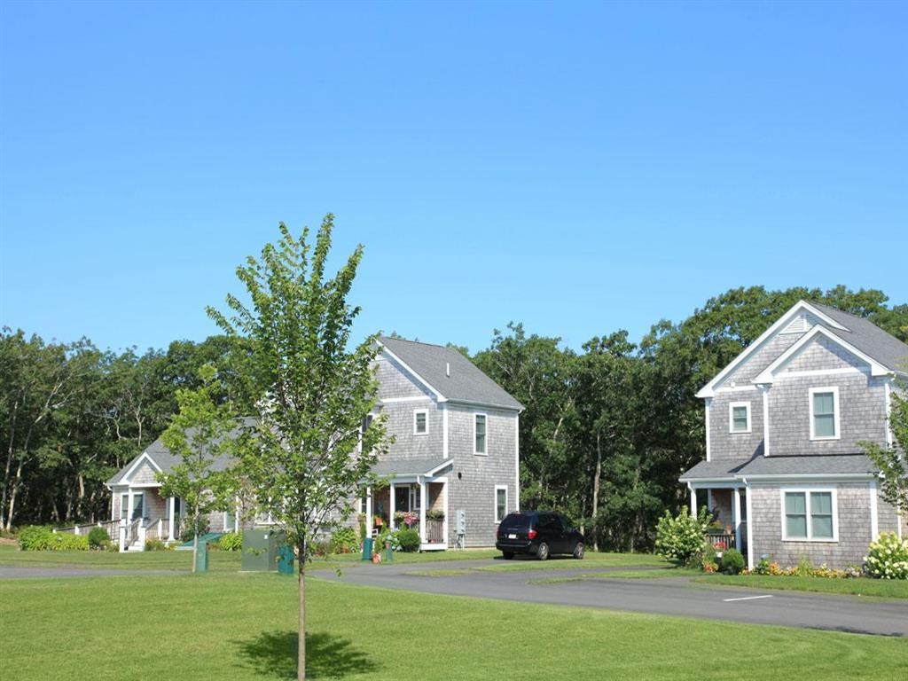a car parked in front of some houses