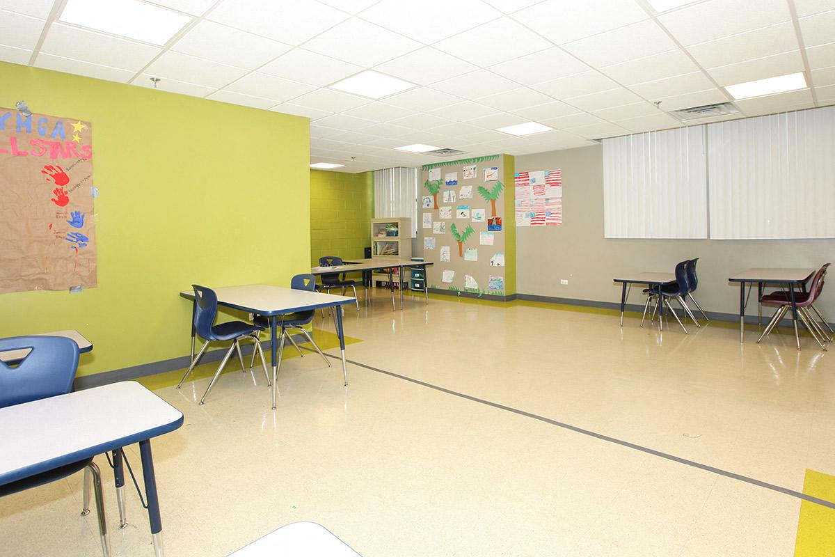 a large room with tables and chairs in it