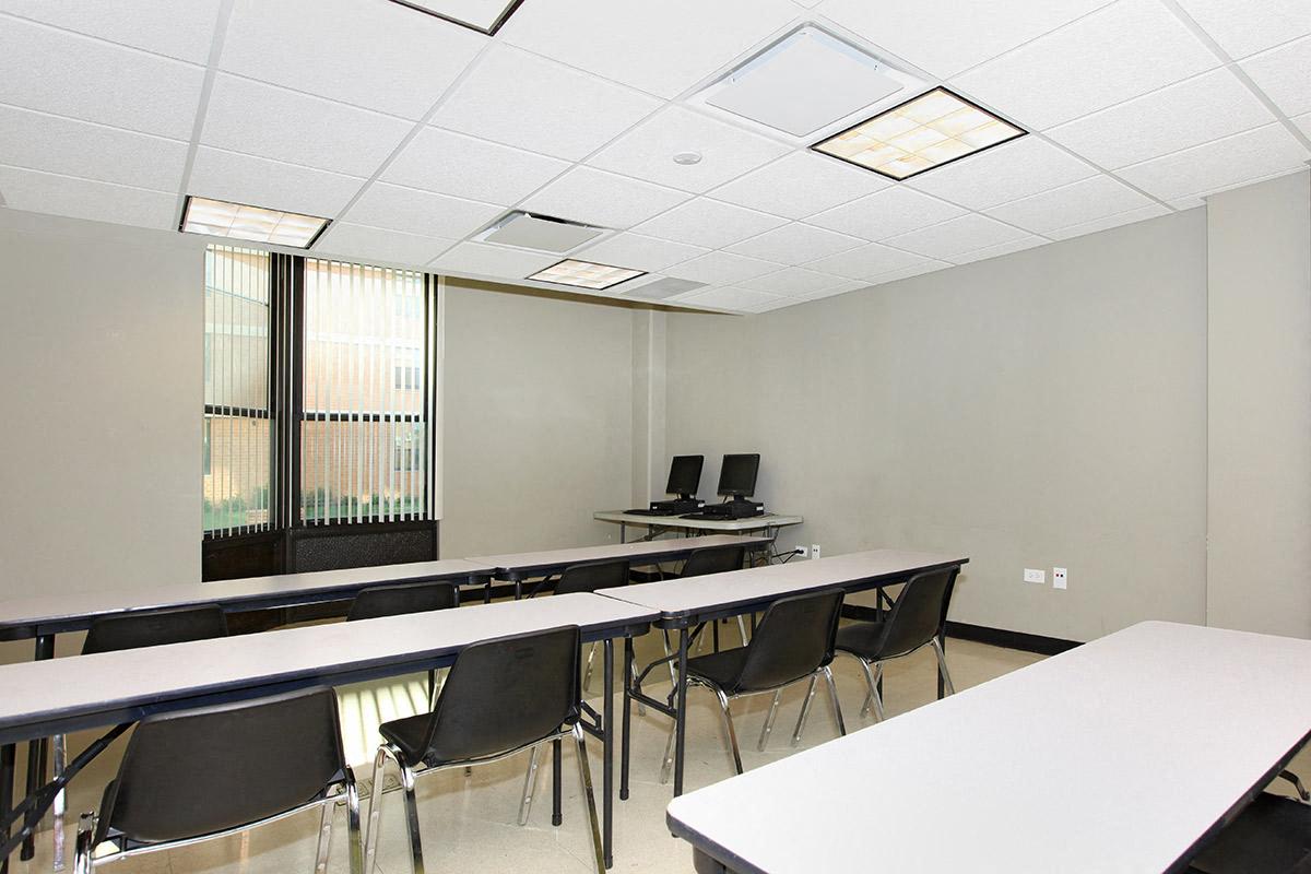 a large room with tables and chairs and chairs