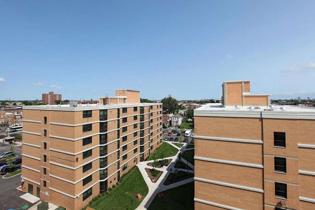an aerial view of several buildings in a city