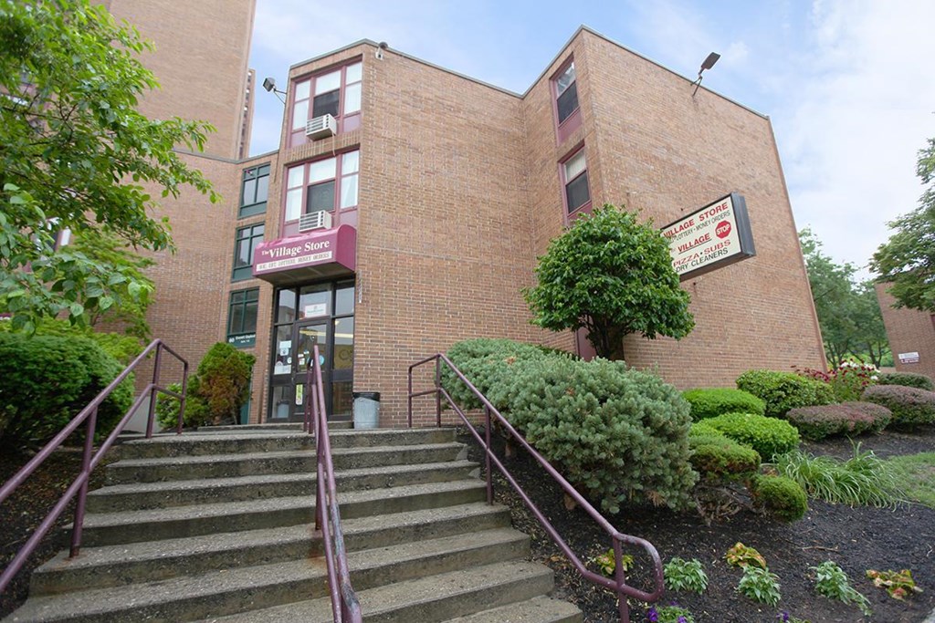 the front of a brick building with stairs