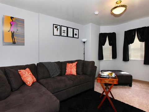 a living room with a couch and a table