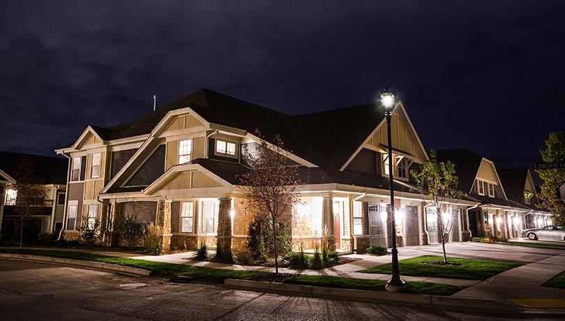 a large house on a street at night