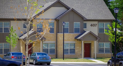 a building with cars parked in front of it