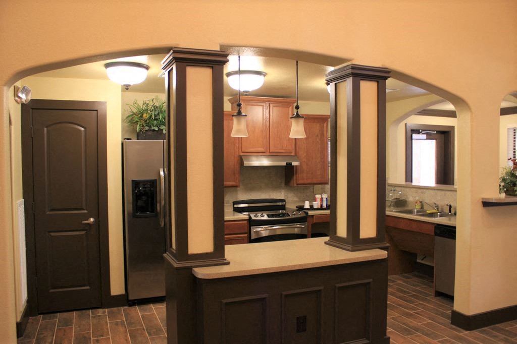 a kitchen with a counter in the middle of it
