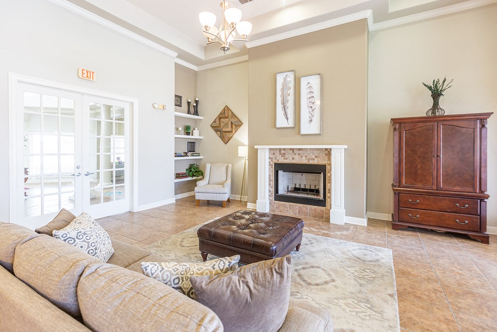 a living room with a couch and a fireplace