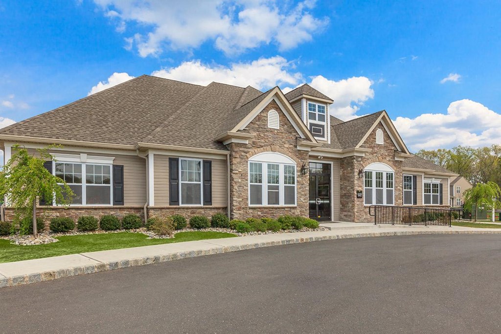a large house with a street in front of it