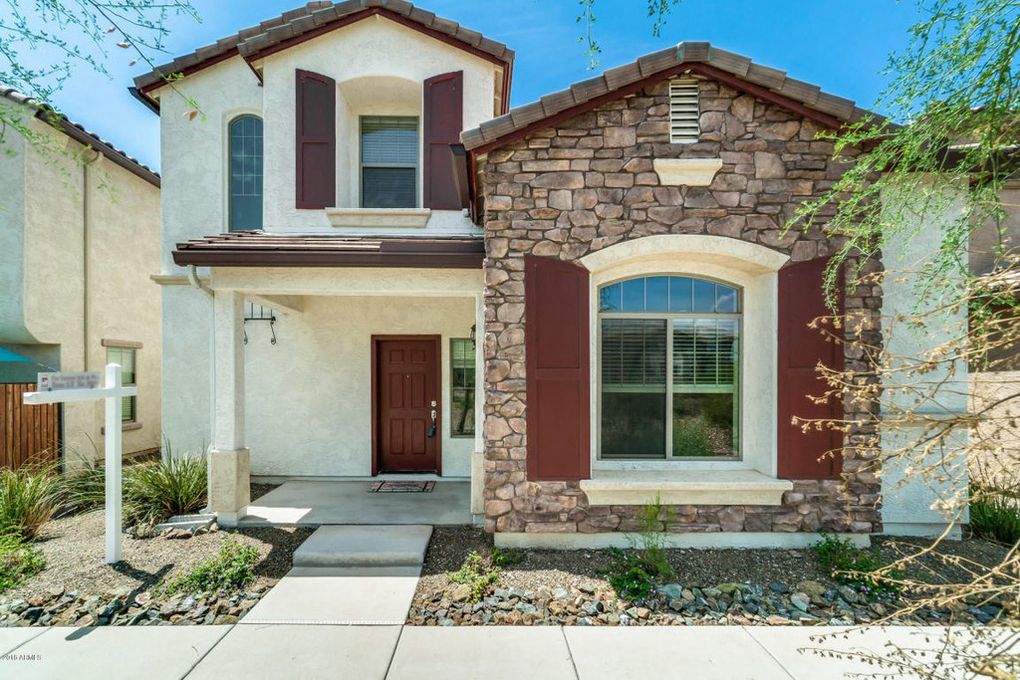 a house with a sidewalk in front of it