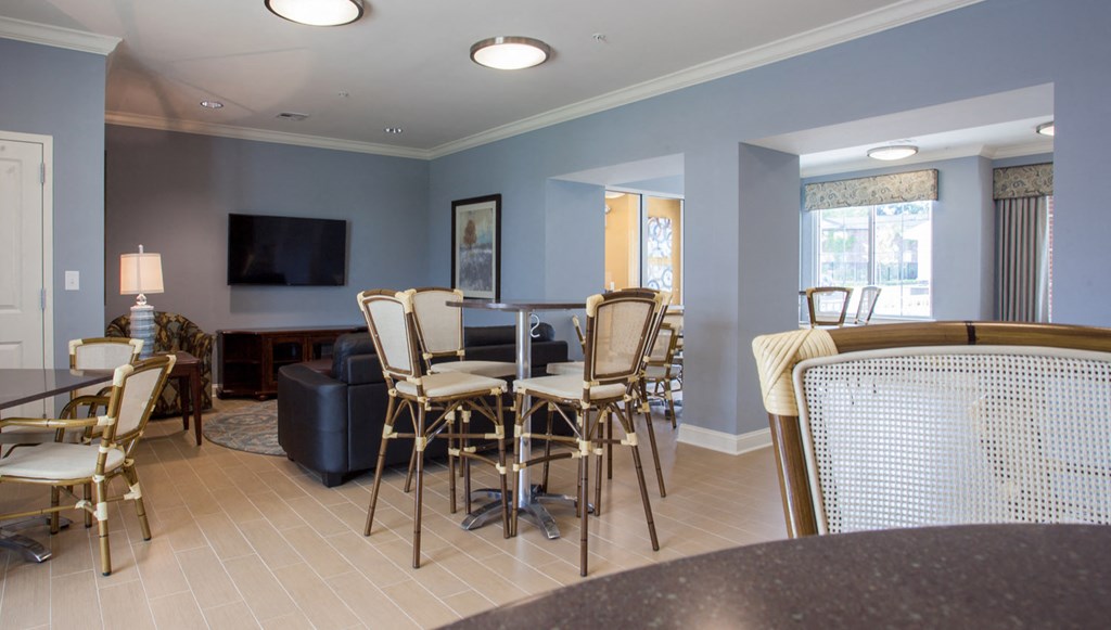 a dining room with a table and chairs and a television