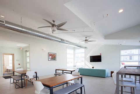 a dining room with a table and chairs and a couch