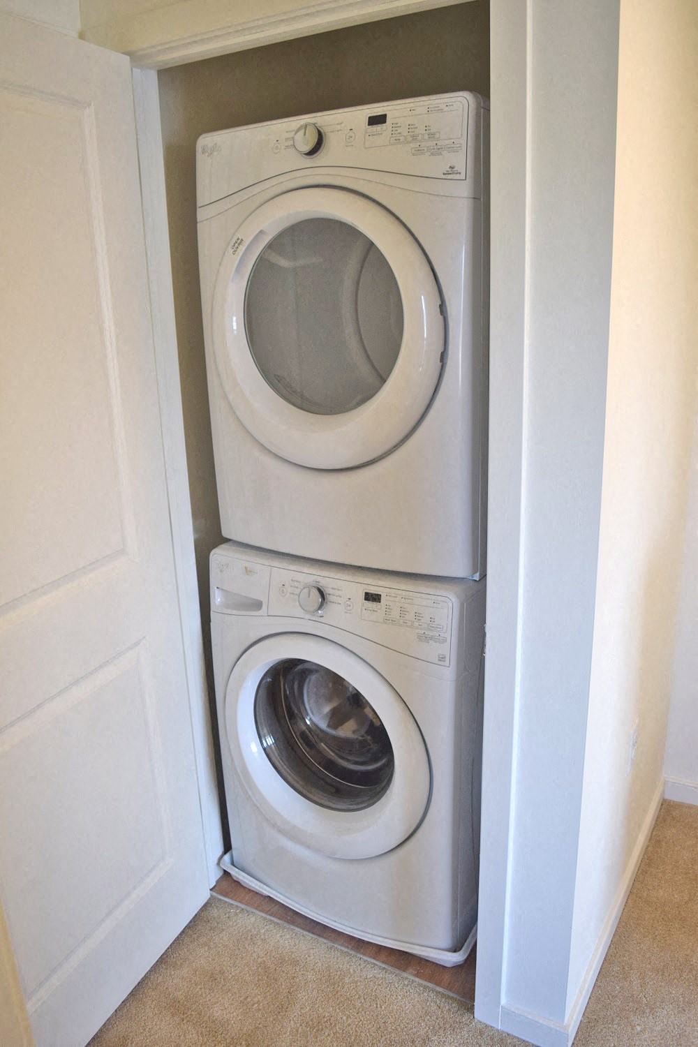 a washing machine and a dryer in a closet
