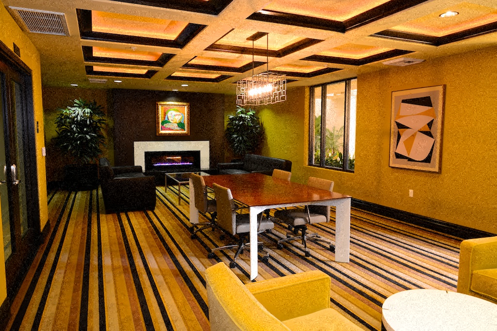 a conference room with a table and chairs