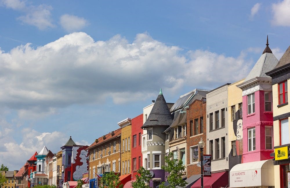 a row of colorful buildings on a city street