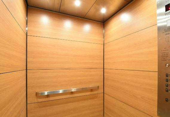 a large wooden wardrobe with a metal handle