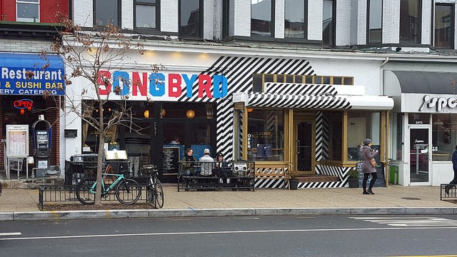 a restaurant on the side of a city street