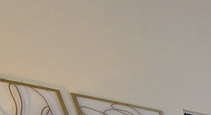 a bedroom with a bed and dresser and a window