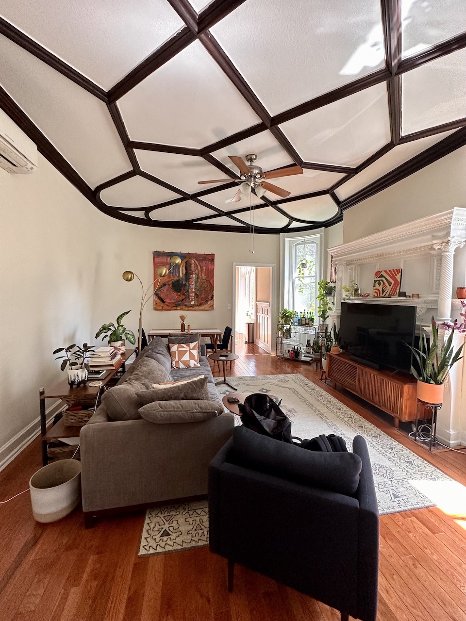 a living room with a ceiling fan and a couch
