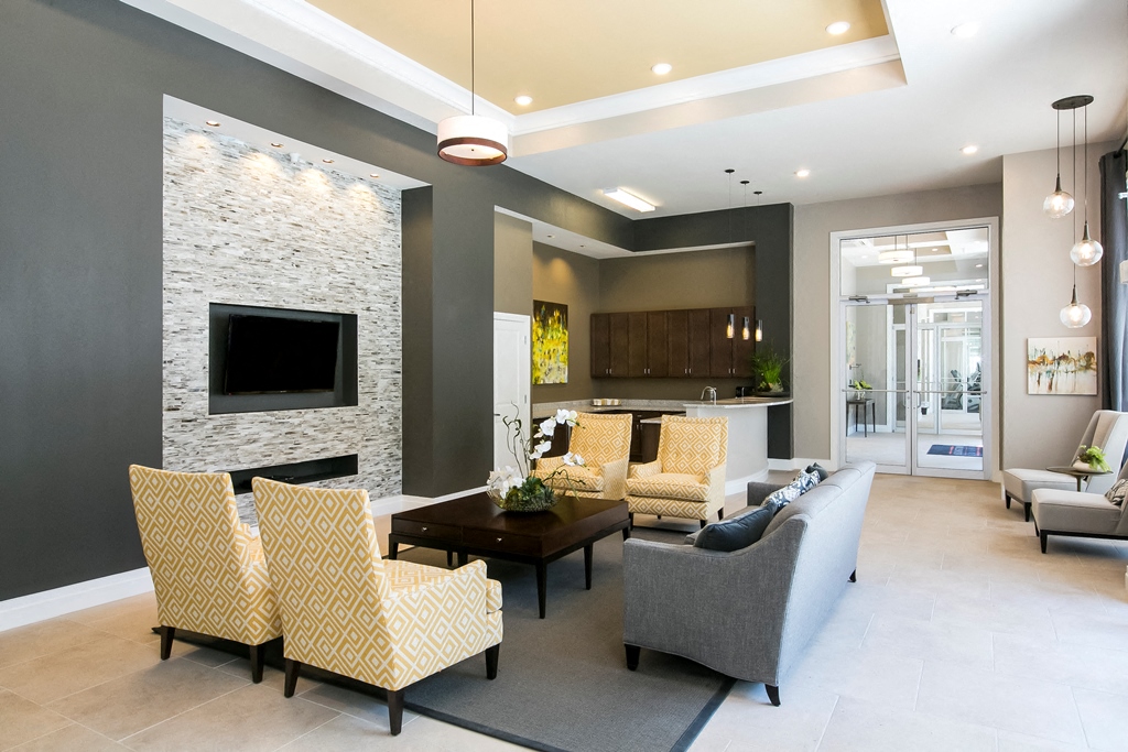 a living room with couches and chairs and a fireplace