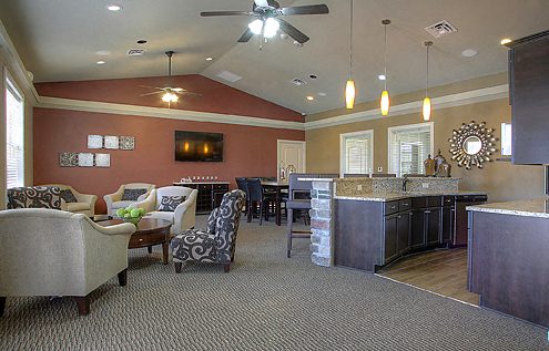 a living room with a kitchen and a dining room