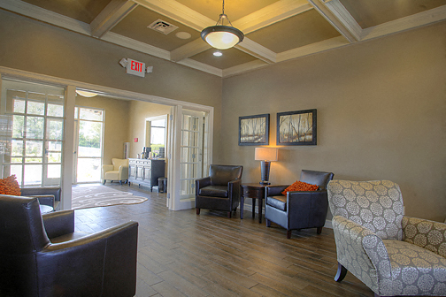 a living room with couches chairs and a table