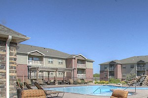 Summit Falls Firepit our apartments offer a pool and lounge area with chairs