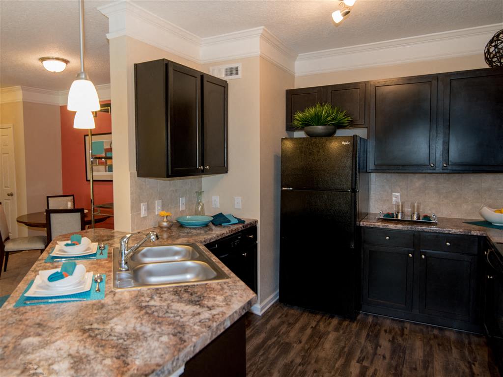 classic kitchen: sink, refrgerator, dishwsher, oven/stove, and microwave