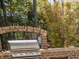 poolside grilling station and outdoor seating