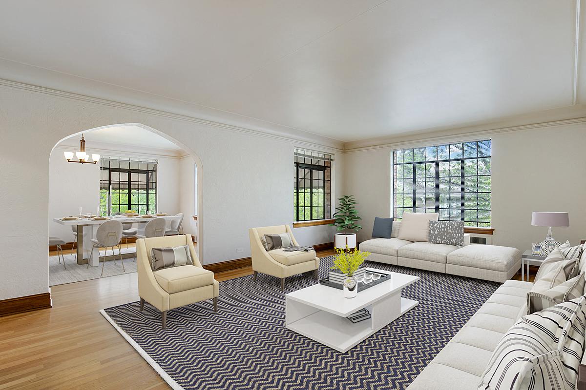 a living room with a white couch and a coffee table