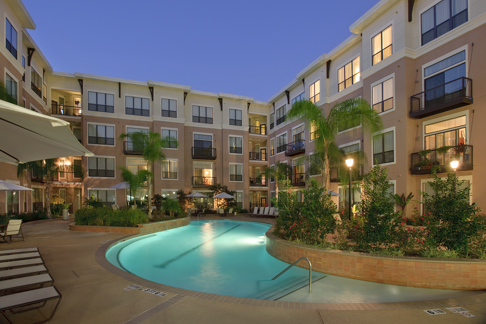 a swimming pool in the middle of an apartment building