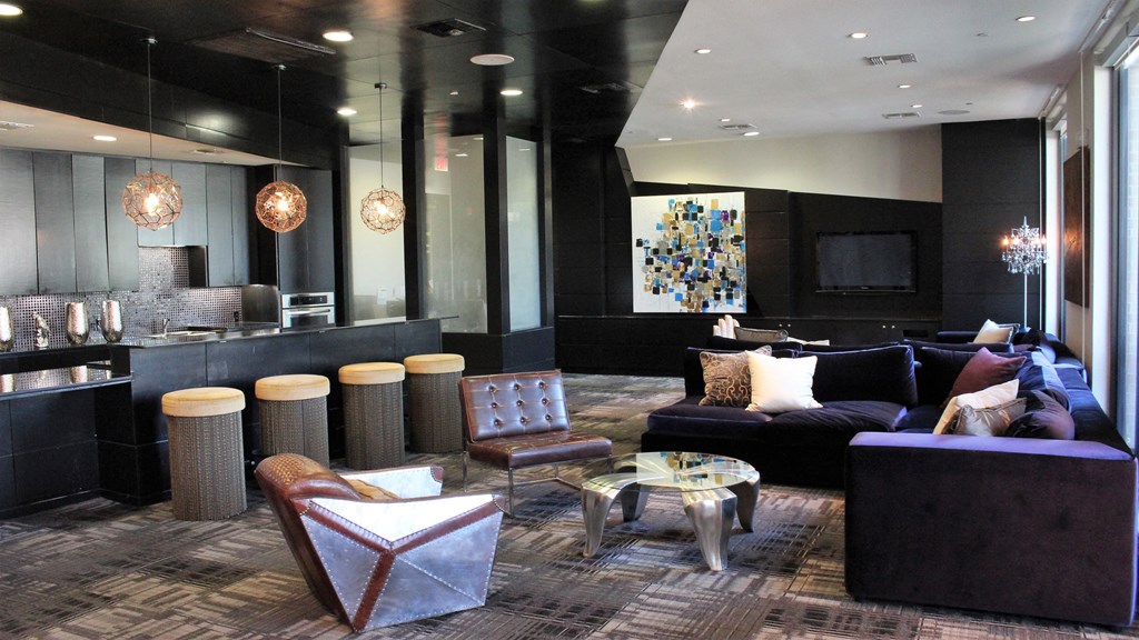 a living room and kitchen in a hotel suite