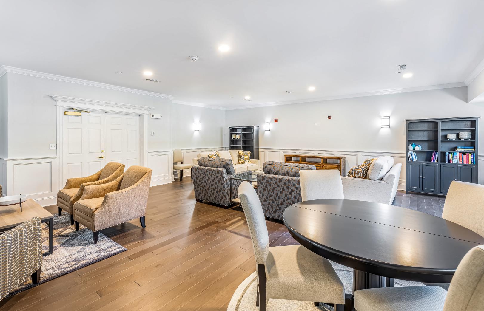 a living room with couches and chairs and a table