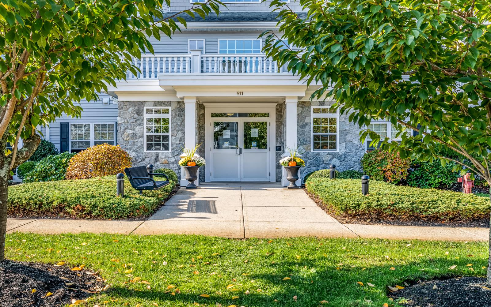 the front of a house with a white door