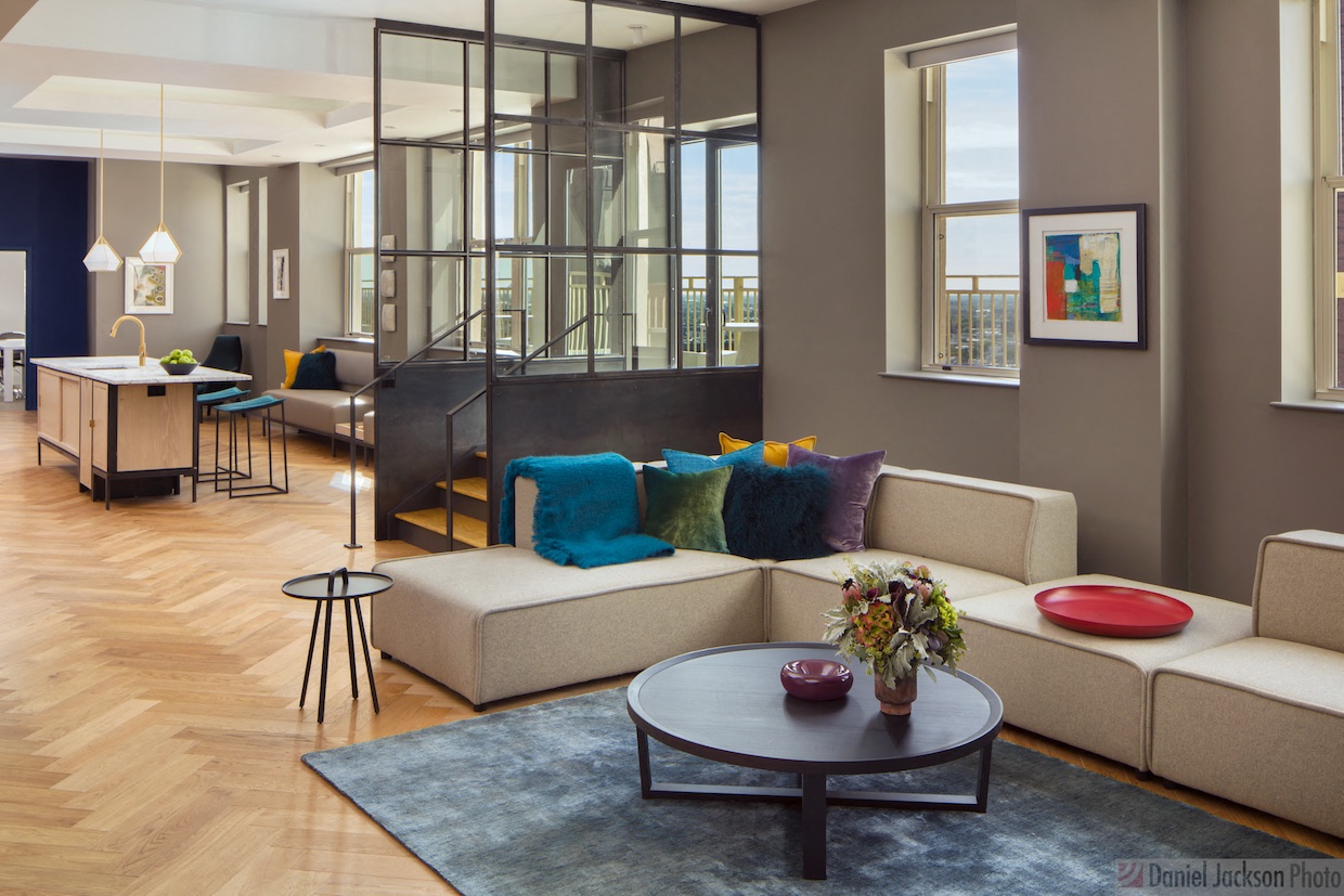 a living room with a couch and a table