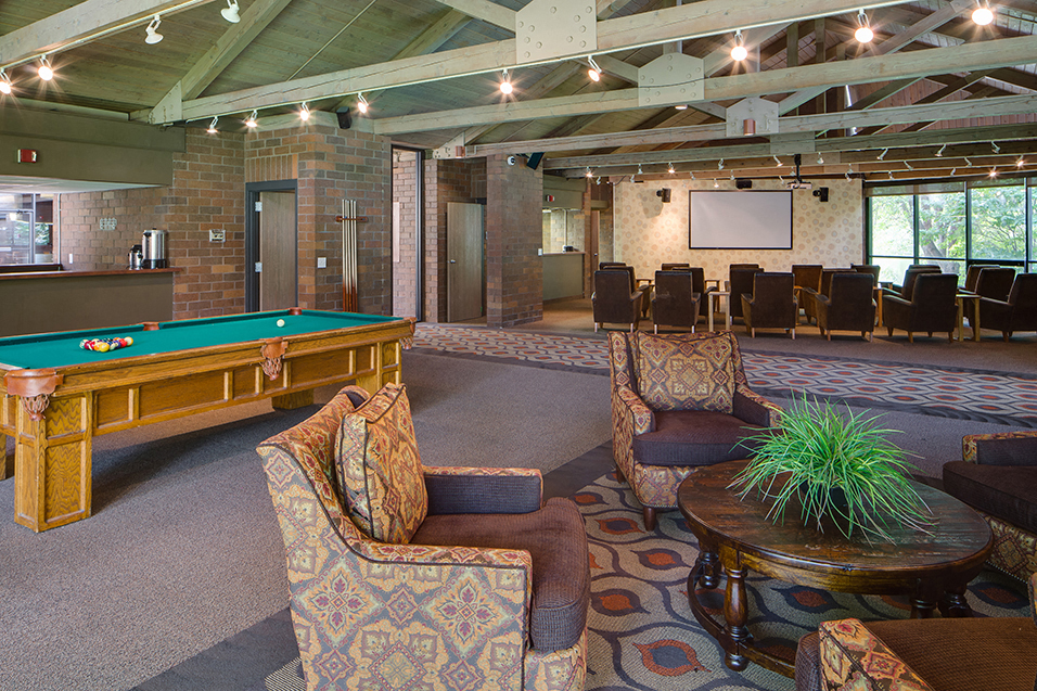 Community room with conversational seating, a pool table, and a theater room