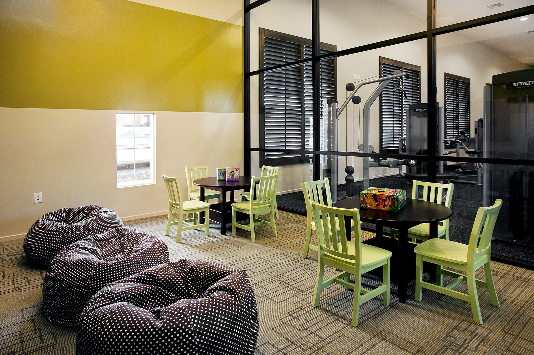 a living room with a table and chairs and a couch