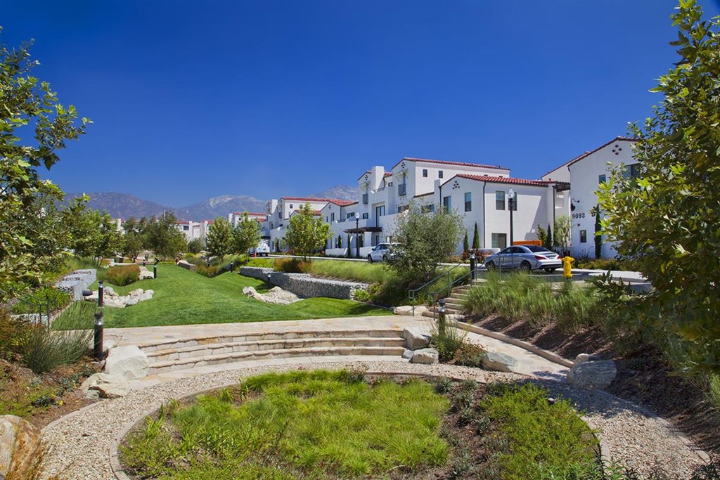 a garden outside a building with stairs