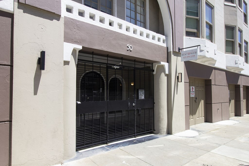 A building with a black gate and the number 30 on it.