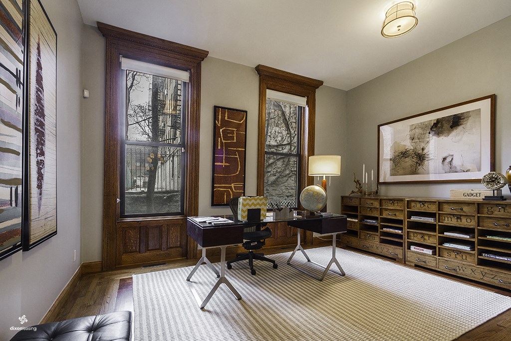 a home office with a desk and a globe