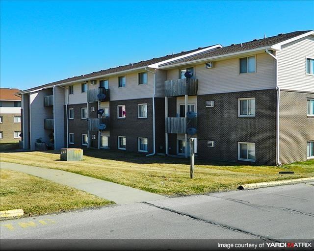 an apartment building on the side of a street