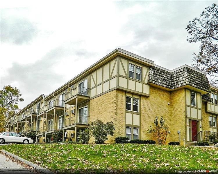 a building with a car parked in front of it