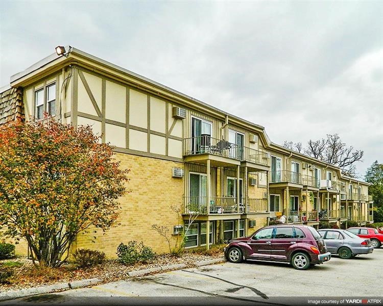 a building with cars parked in front of it