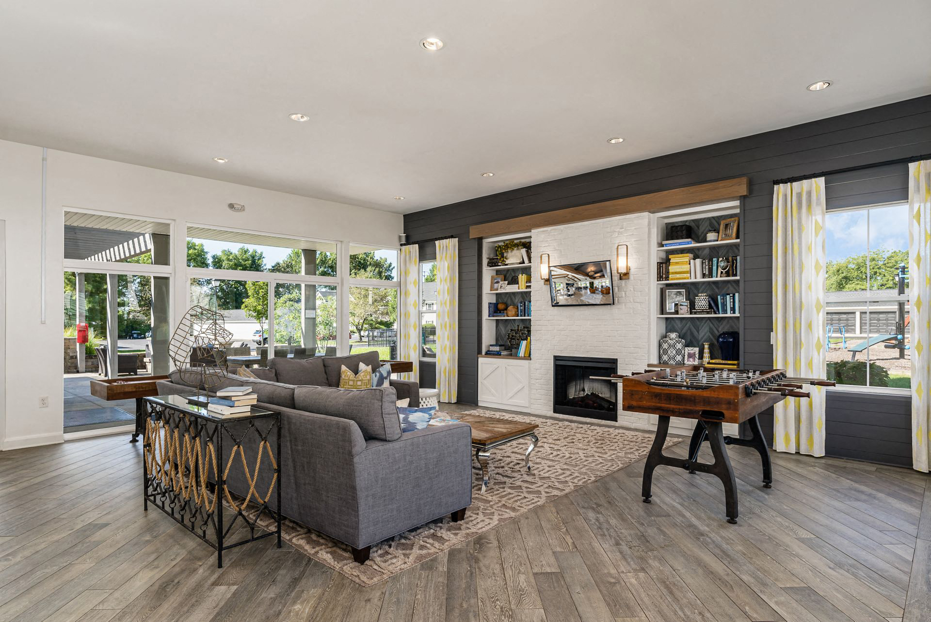 a living room with a couch and a table and a fireplace
