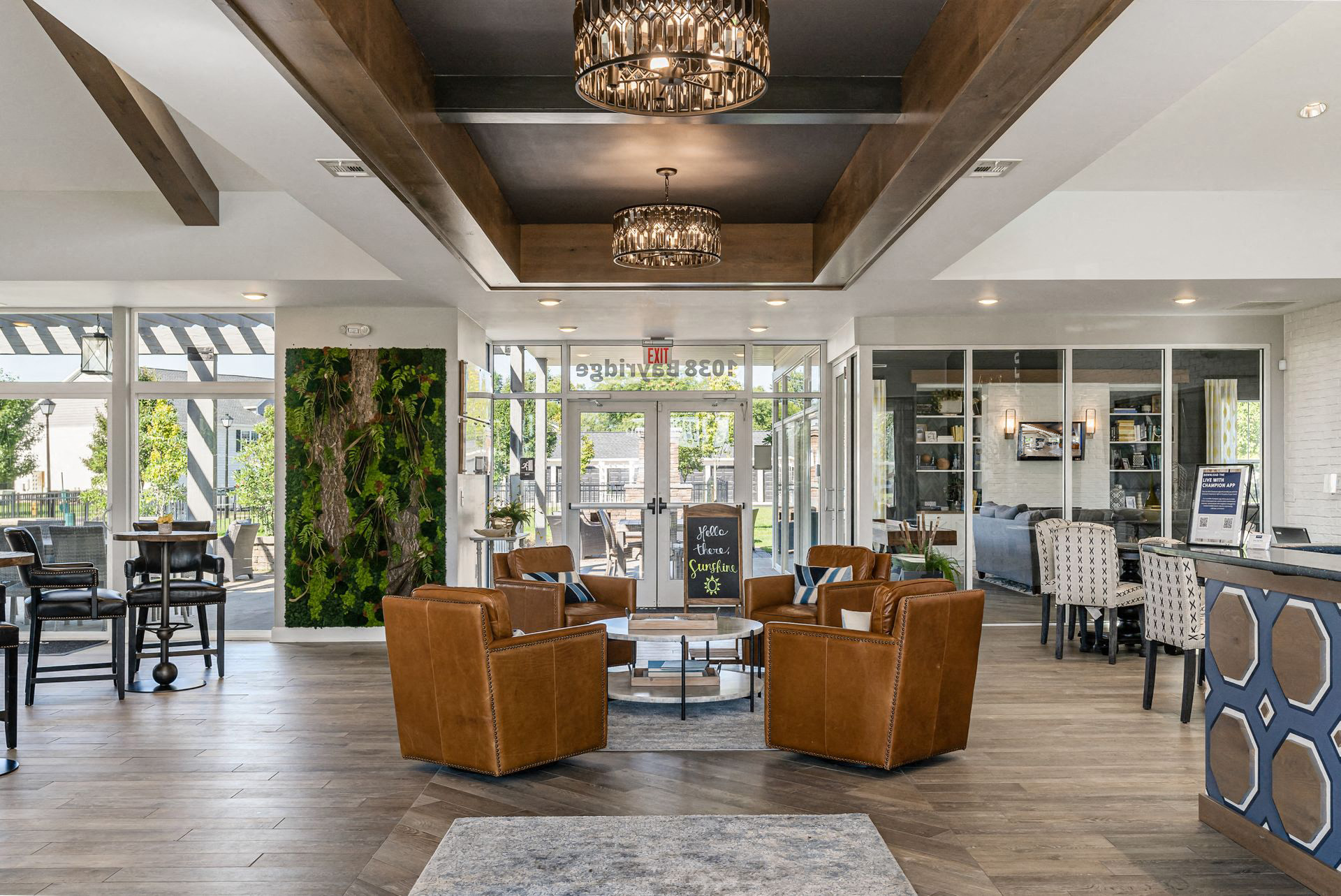 the lobby of a hotel with couches and tables and chairs