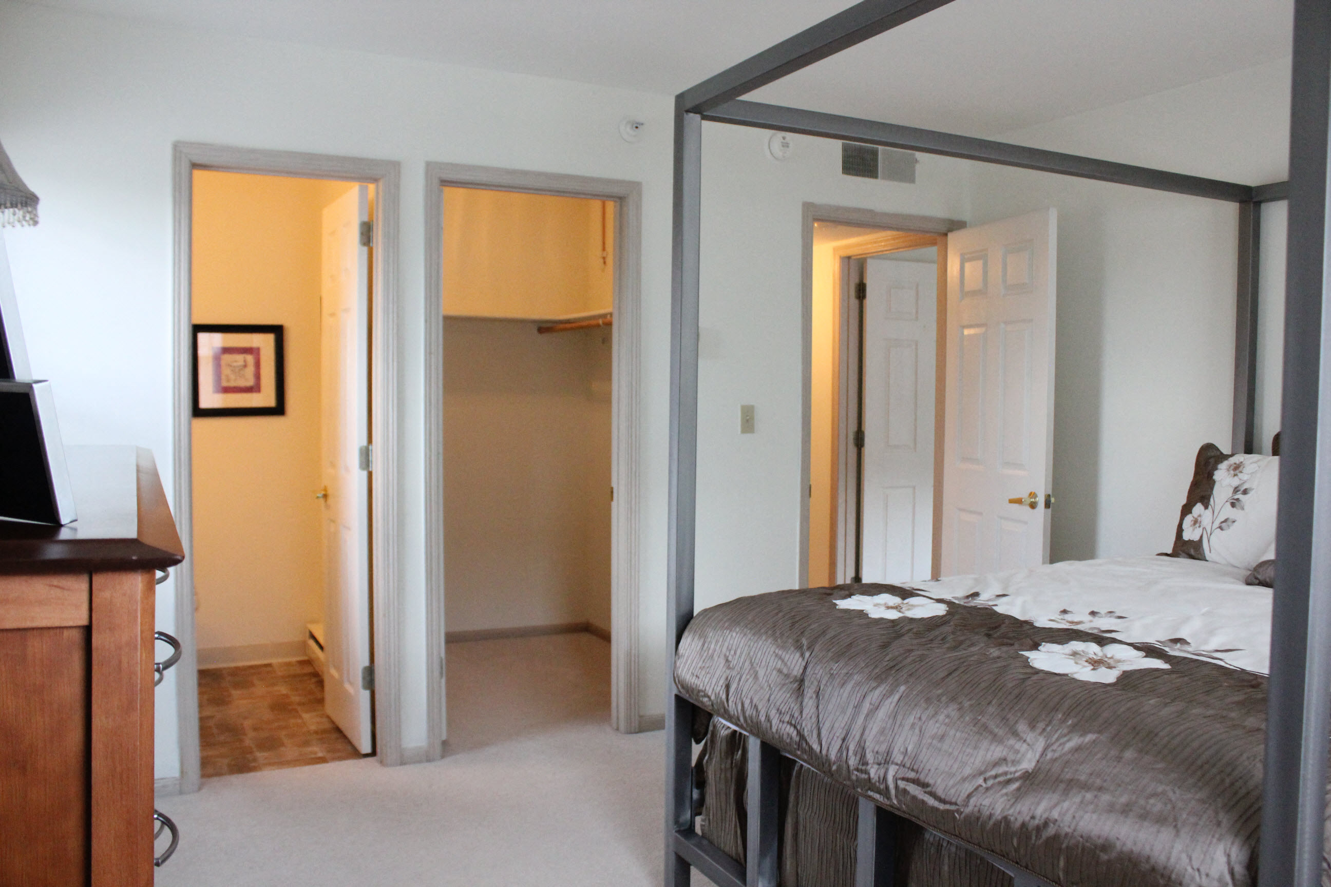 Bedroom with bathroom and ample closet space