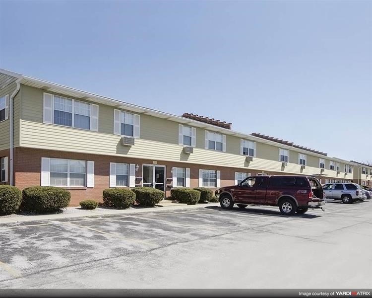 a building with cars parked in front of it